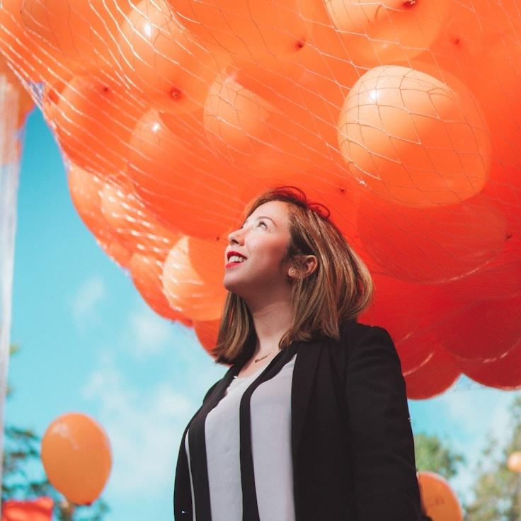 Kaveri Mehta, Lead Design Curator at CrestPavilionLeaf, reviewing corporate floral arrangements